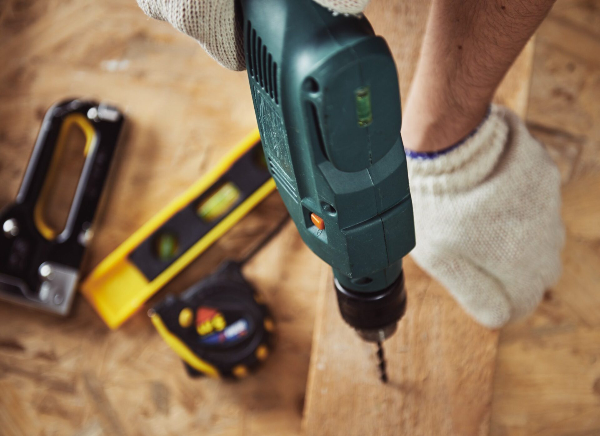 Carpenter working with wood and building tools Carpenter working with wood and building tools
